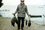 fish catch, ducks, Lake, Water, man, jacket, hat, Currituck North Carolina, SFIV02P12_02