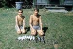Boys, Fish catch, backyard, brothers, Cape Cod, Massachusetts, 1950s, SFIV02P14_04