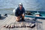 fish, fisherman, dock, lake, water, fish catch, man, male, Manitoba, Canada, 1970, 1970s, SFIV02P15_13