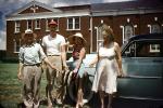 Men, Women, fish catch, home, house, building, 1950s, SFIV03P02_07