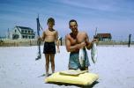 Boy with a Spear Gun, swim trunks, raft, Fish, Beach, Sun Tan, SFIV03P04_17