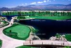 putting green, water hazard, bridge, paths, palm trees, mountain range, Palm Springs