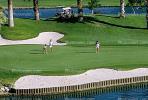 sand trap, water hazard, lake, golfer, golf cart, Palm Desert, California, SGFV01P10_15