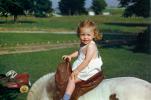 Little Girl in a Pony Saddle, cute, 1950s