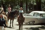 Cars, Girls riding horses, Ford El Rancho, California, 1950s