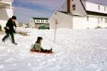 Boys Sledding at Home, Car, Houses, Winter, 1950s, SKFV01P05_06