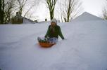 Girl Sliding down a hill in the Snow, smiles, mittens, SKFV01P06_17