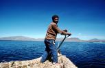 Man, smiles, water, mountains, Reed Boat, Totora Reeds, Lake Titicaca, SRKV02P06_16