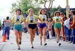 Woman runner, crowds, spectators, Oakland Half Marathon finish line, SRSV04P05_12