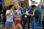 Woman runner, World Runners, crowds, spectators, Oakland Half Marathon finish line, SRSV04P05_13