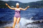 Woman in a purple all in one, aio, swimsuit, one piece, bathing cap, water, 1950s, SWAV01P08_15