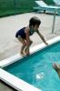 little girl jumping into a swimming pool, SWDV01P14_18