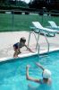 little girl jumping into a swimming pool, SWDV01P14_19