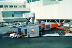 San Francisco International Airport (SFO), ground personal, carts, baggage tractors, JAL, TAAV02P06_18