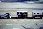 San Francisco International Airport (SFO), ground personal, carts, baggage tractor, TAAV08P03_14
