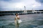 Woman, Purse, Terminal building, Bangkok Airport, October 1962, 1960s, TAAV15P02_03