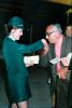 Flight Attendant, Stewardess, man kisses womans hand, ticket, hat, uniform, June 1971, TAAV15P11_16