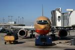 San Diego, Lindbergh Field, Boeing 737, pusher tug, baggage cart, TAFD02_064