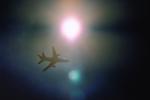 Lockheed L-1011 flying under the sun