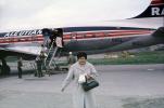 N65L, Reeve Aleutian Airways, Douglas DC-6B, Passenger, Woman, Purse, Coat, Alaska, 1950s, TAFV25P01_17