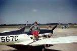 Girl posing on a Forney F-1, N7567C, Pottstown Municipal Airport, September 1960, TAGV10P10_05