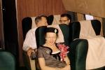 Passengers on a flight, Seats, Seating, Woman, Corsage, hat, smiles, 1950s, TAIV02P04_19