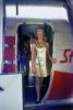 "Paper Uniforms" for the "Foreign Accent Service", Hostess, golden dress, Stewardess, Flight Attendant, Cabin Crew, Convair StarStream CV-880, 880, 1968, 1960s