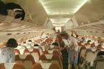 Stewardess, Cabin Crew, overhead bins, luggage, seats