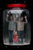 Family Caught in a Jar, the inability for the earths thin atmosphere to cleanse human caused pollution, Climate Change, Global Warming, Photo-Illustration