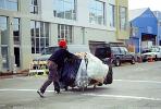 crosswalk, Homeless man with a cart full of recyclable waste