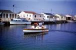 Houses, Homes, shoreline, docks, powerboats, 1950s