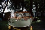 Cute Boy on a Boat on Trailer