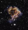 sheets of debris from a stellar explosion in a neighboring galaxy, 'Witch Head' Brews Baby Stars, UGND01_065
