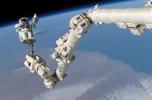 Astronaut anchored to a foot restraint on the Canadarm2, ISS, USSD01_003
