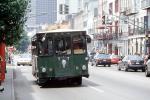 Trolley Bus head-on, street, buildings, cars, traffic