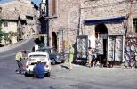 Street scene, buildings, car, Assisi Italy, minicar, Fiat mini-car, October 1969, 1960s, VCOV01P01_17