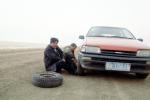 Changing a Flat Tire, near Xilinhot, Inner Mongolia, China, VCOV01P04_06