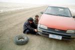 Changing a Flat Tire, near Xilinhot, Inner Mongolia, China, VCOV01P04_07