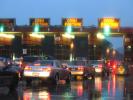 Bay Bridge Toll Plaza on a Rainy Day, Rain, Car, Vehicle, Auto, Road, Roadway, Exterior, Outdoors, Outside, wet, slippery, inclement weather, bad, Rainy, Bad Driving Conditions, Dangerous, Precipitation, sedan, tollbooth, VCRD01_224
