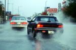 Chrysler Le Baron Car, Downpour Flooding, splash, Alamogordo, City Street, VCRV09P14_02