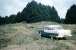 car, sedan, Vehicle, Oldsmobile, Dirt Road, unpaved, 1950s , 1950s, VCRV20P04_15