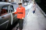 Doorman, sidewalk, valet, man, smiles, belt, jacket, hat, Car, Automobile, Vehicle, 1940s, VCRV20P11_17