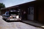 Cadillac, two-door sedan, Trunk full of luggage, Motel, building, Fins, 1950s, VCRV21P08_04