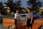 Plymouth Belvedere, Woman, Man, tail fins, suburbia, 1950s, VCRV21P12_01