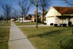 Homes, Houses, suburbia, cars, sidewalk, driveway, lawns, buildings, 1950s, VCRV22P05_12