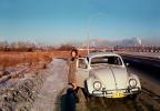 Volkswagen Bug, Beetle, Car, Woman, Quebec Canada, January 1964, 1960s, VCRV22P10_14