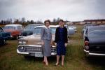 Women in front of a Chevy, car, 1959, 1950s, VCRV22P14_14