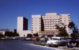 Hospital Parking Lot, building, cars, 1950s, VCRV23P01_15