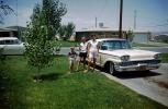 Mother, Daughter, Son, siblings, 1959 Ford Mercury Monterey, suburbia, driveway, 1950s