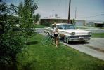 1959 Ford Mercury Monterey, Girl with her Bicycle, suburbia, driveway, 1950s, VCRV23P06_14